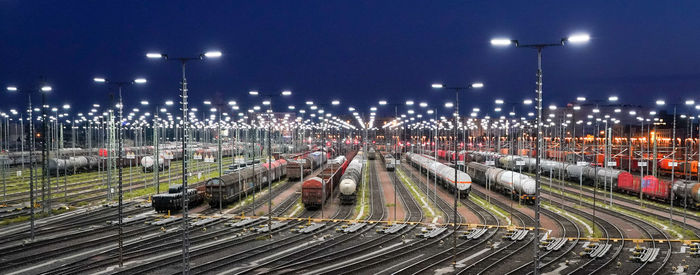 High angle view of train on street at night