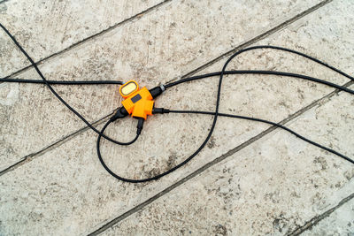 High angle view of yellow umbrella on floor