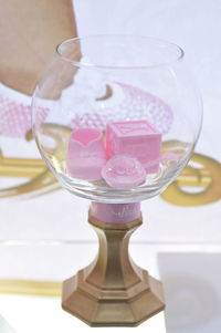 Close-up of pink wine glass on table