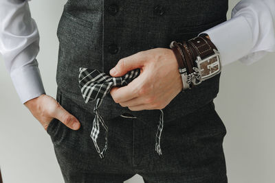 Close-up of hand holding hands against blurred background