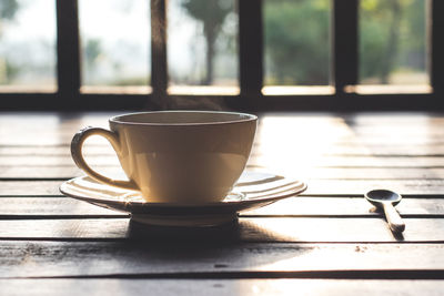 Close-up of coffee cup on table