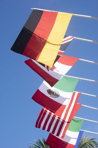 The national flags of germany, england, canada, mexico, united states, and italy flying 