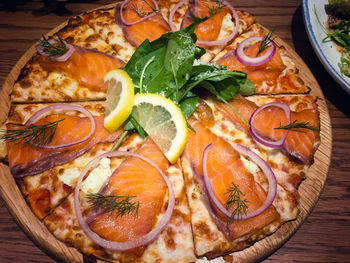 High angle view of pizza served on table