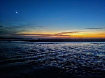 Scenic view of sea against sky at sunset