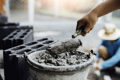 Close-up of man working on metal