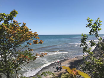 Scenic view of sea against clear blue sky