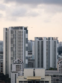 Modern buildings in city against sky