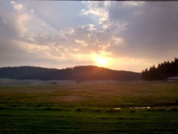 Scenic view of landscape against sky during sunset