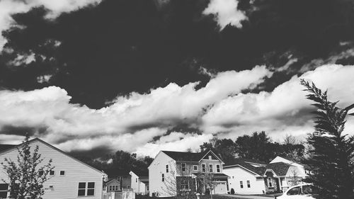 Low angle view of building against cloudy sky