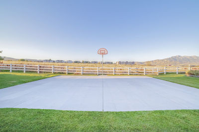 Scenic view of field against clear sky