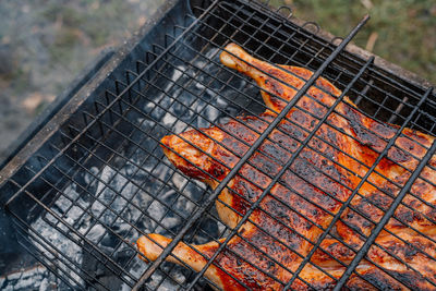 Close-up of meat on barbecue grill