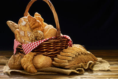 Close-up of wicker basket against black background