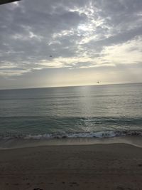 View of sea against cloudy sky