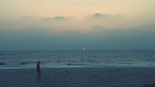 Scenic view of sea at sunset