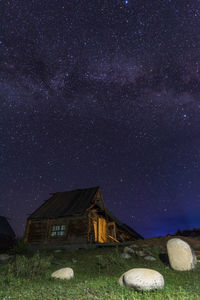 Scenic view of field against sky at night