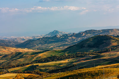 Aerial view of landscape and mountains against sky