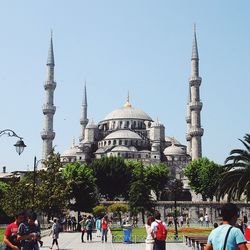 Tourists in front of building