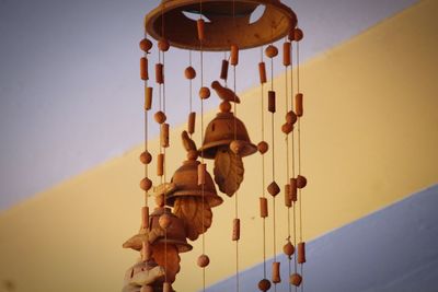 Low angle view of decoration hanging against clear sky