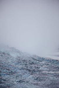 Scenic view of landscape against sky during winter