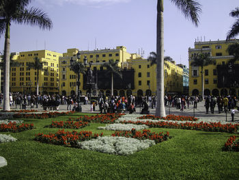 People at town square against sky