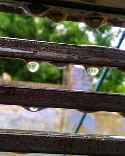 Close-up of water drops on rusty metal