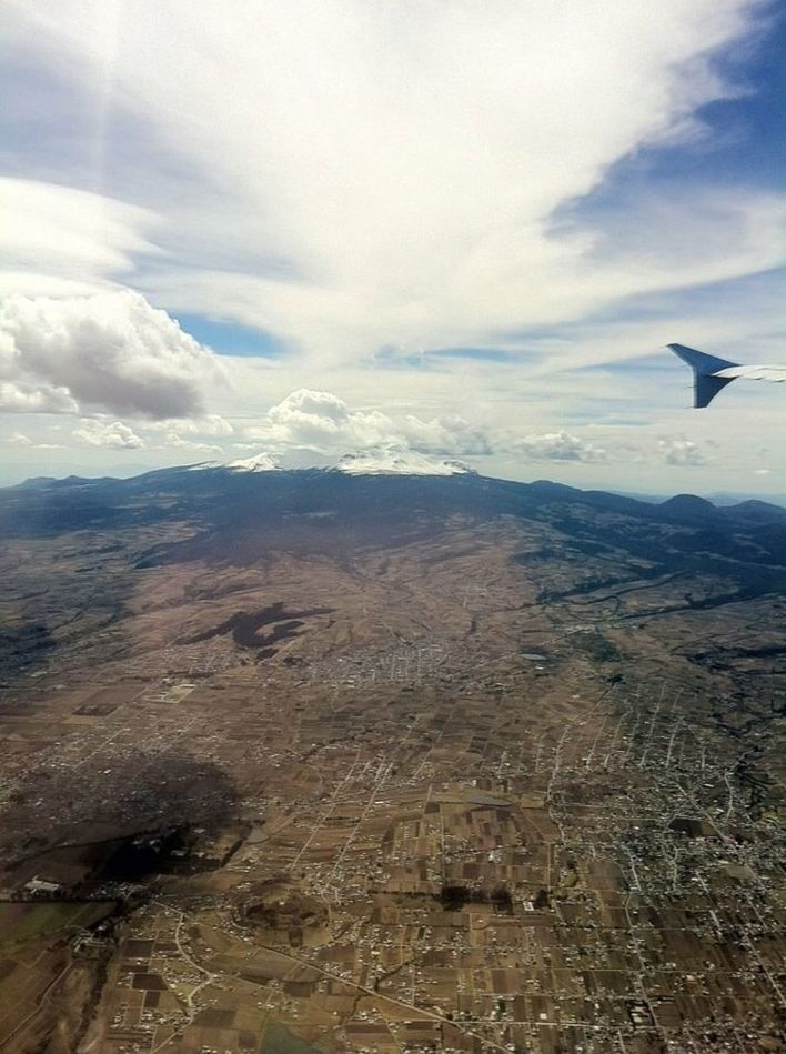 airplane, flying, aircraft wing, air vehicle, landscape, transportation, mountain, sky, scenics, aerial view, mode of transport, mid-air, beauty in nature, part of, cropped, travel, tranquil scene, mountain range, nature, tranquility