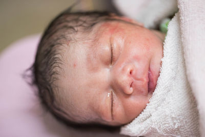 Close-up high angle view of baby boy sleeping