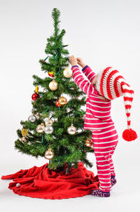 Close-up of christmas tree against white background