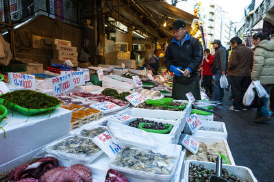 People at market stall