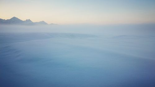 Scenic view of mountains against sky during sunset