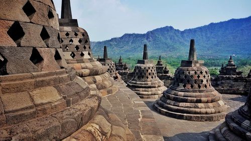 Panoramic view of temple and building against sky