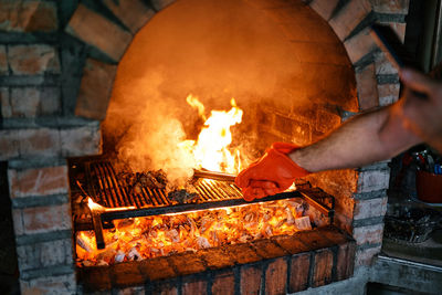 Cropped hand preparing food