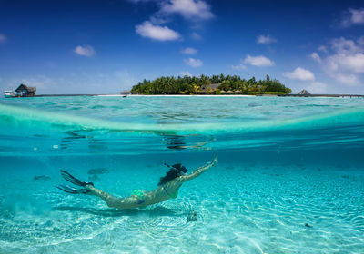 Side view of woman swimming in sea