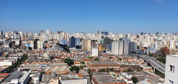 High angle view of modern buildings against clear sky