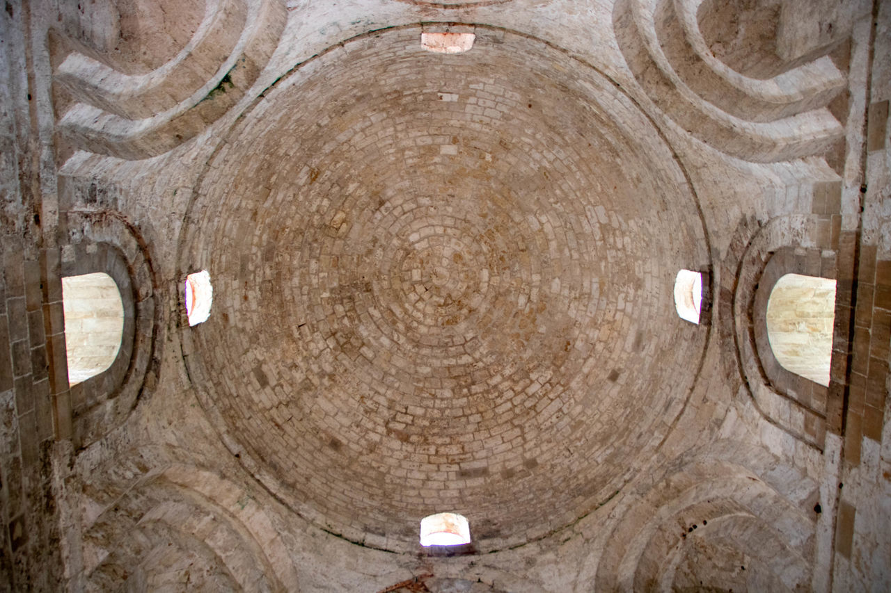 ancient history, circle, wood, geometric shape, no people, shape, indoors, pattern, temple, architecture, backgrounds, textured, day, tunnel, full frame, wall, ceiling