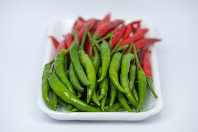 Close-up of salad in plate against white background