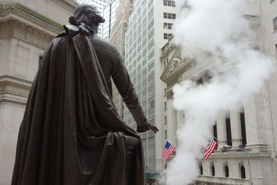 Low angle view of statue in city