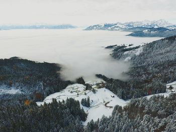 Scenic view of snow covered mountains against sky