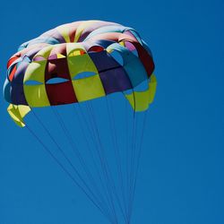 Low angle view of kite against blue sky