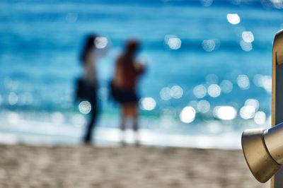 Blurred motion of woman on beach