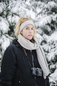 Portrait of smiling woman in snow