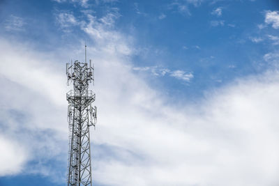 Low angle view of communications tower against sky