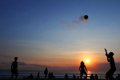 Silhouette of people on beach