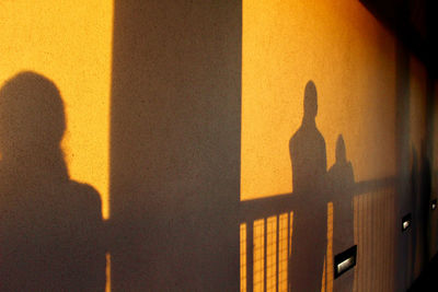 Shadow of people on wall