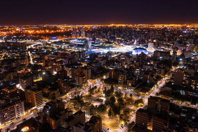 High angle view of illuminated city buildings at night