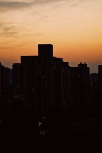 Silhouette of city at sunset