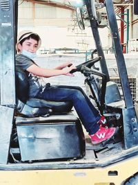 Portrait of boy sitting in bus