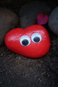 Close-up of red toy on ground