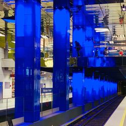 Reflection of illuminated railroad tracks on building