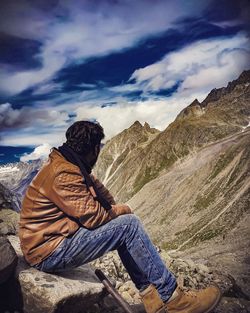 Man sitting on rock